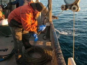 James Longley retrieves a recorder from the Bering Sea. (Photo courtesy Ricardo Antunes)