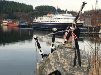 Rob Alley plays the bagpipes as a send off for the ferry Taku as the ship departs Ketchikan’s Ward Cove on March 13, 2018.
