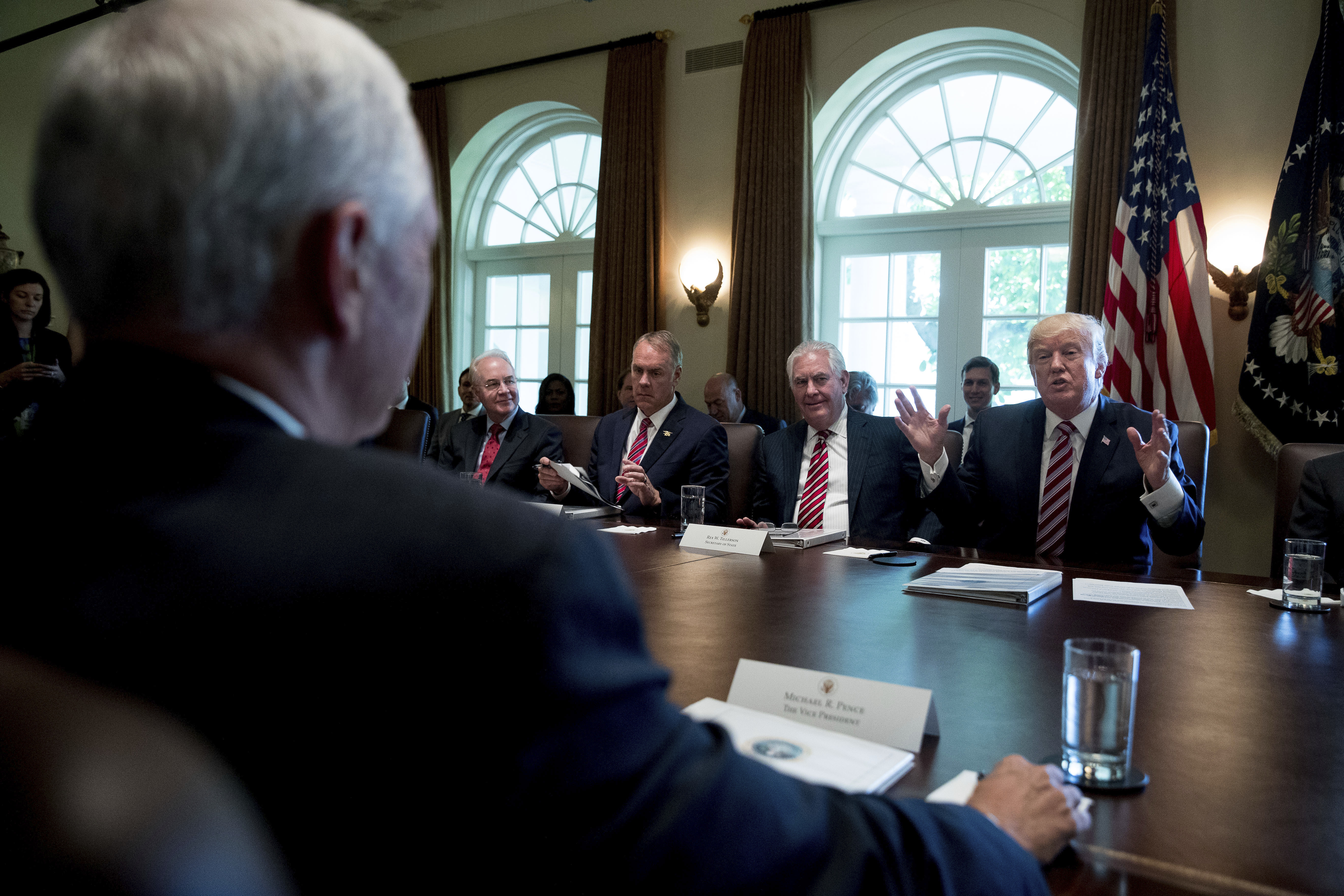 President Trump speaks during a Cabinet meeting on June 12, 2017. From left are, Vice President Pence, foreground, then-Health and Human Services Secretary Tom Price, Interior Secretary Ryan Zinke and Secretary of State Rex Tillerson and the president. Price was fired by Trump last year, Tillerson was fired last week. (Photo by Andrew Harnik/AP)
