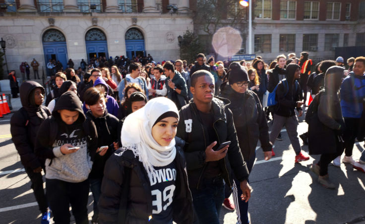 Hundreds of students walk out of Midwood High School on Wednesday, as part of a nationwide protest against gun violence in Brooklyn.