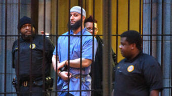 Adnan Syed, subject of the podcast Serial, is escorted from a courthouse in February 2016. An appellate court has upheld a previous decision to vacate Syed's 2000 conviction