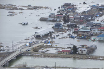An aerial view of Ishinomaki, Japan, on March 18, 2011, one week after a devastating 9.0 magnitude earthquake and subsequent tsunami. LANCE CPL. ETHAN JOHNSON / U.S. MARINE CORPS.