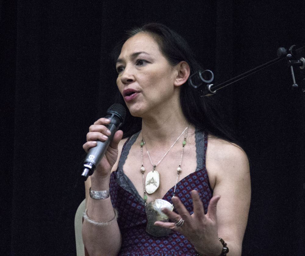 Actress Irene Bedard talks about raising her son and her sister, who were abused and sex trafficked, during "An Evening of Stories," an event Monday, April 23, 2018, to raise awareness of domestic violence and sexual assault, at the Elizabeth Peratrovich Hall in Juneau. (Photo by Tripp J Crouse/KTOO)