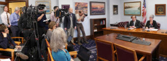 In this two-photo composite, Senate Finance Committee co-chairs Lyman Hoffman, D-Bethel, and Anna MacKinnon, R-Eagle River, take questions from reporters during a press conference on April 5, 2018. They held the meeting to discuss the Senate Finance Committee’s version of the state operating budget. (Photo by Skip Gray/360 North)