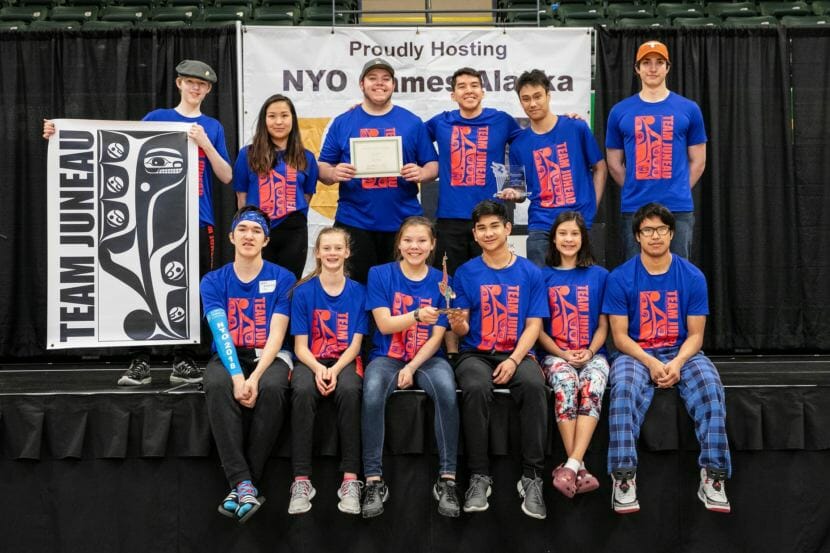 Juneau's 2018 Native Youth Olympics team at the statewide competition in Anchorage. Top row, left to right: Arthur McVey, co-coach Kaytlynne Lewis, Derrick Roberts, Kyle Worl, Bryan Johnson and Joe Dundore. Bottom row, left to right: Josh Sheakley, Skylar Tuckwood, Kalila Arreola, Matthew Quinto, Trinity Jackson and Erick Whisenant. (Photo by Brian Wallace, courtesy of Sealaska Heritage Institute)