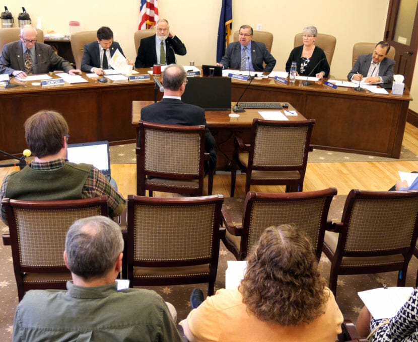 The legislative conference committee on the state operating budget bills meets in the Alaska Capitol on April 19, 2018. Members of the committee, from left to right, are Reps. Steve Thompson, R-Fairbanks, Neal Foster, D-Nome, Paul Seaton, R-Homer, and Sens. Lyman Hoffman, D-Bethel, Anna Mackinnon, R-Eagle River, and Donny Olson, D-Golovin. (Photo by Skip Gray/360 North)