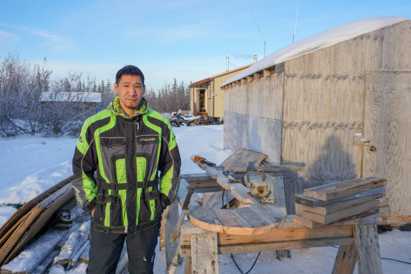 Ben Sherman Jr. stands outside his home in Noatak where he builds sleds. (Hillman/Alaska Public Media)