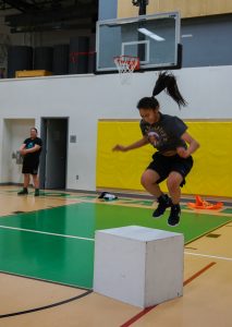 Basketball players run drills at Napaaqtugmiut School in Noatak. (Photo by Anne Hillman/Alaska Public Media)