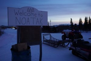 Community members wait for the plane to land at the airstrip in Noatak, a village in the Northwest Arctic. (Photo by Anne Hillman/Alaska Public Media)
