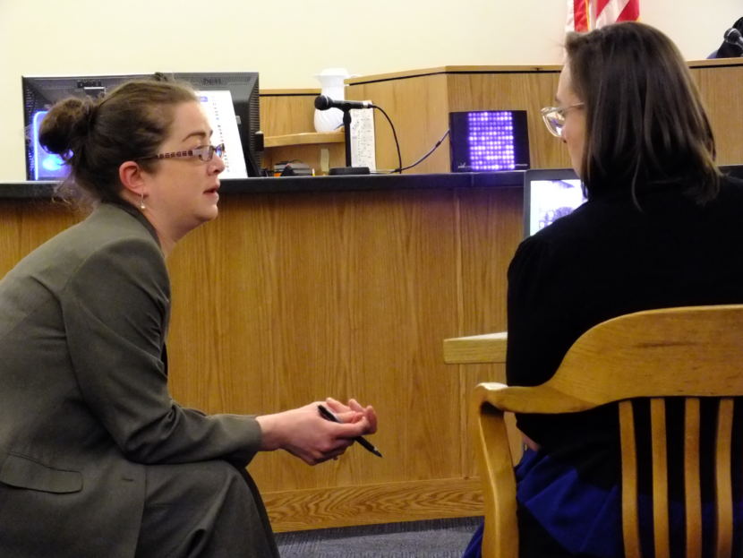 Public Defender Deborah Macaulay (left) and Assistant District Attorney Amy Paige (right) confer during a break Friday in the Mark De Simone trial.