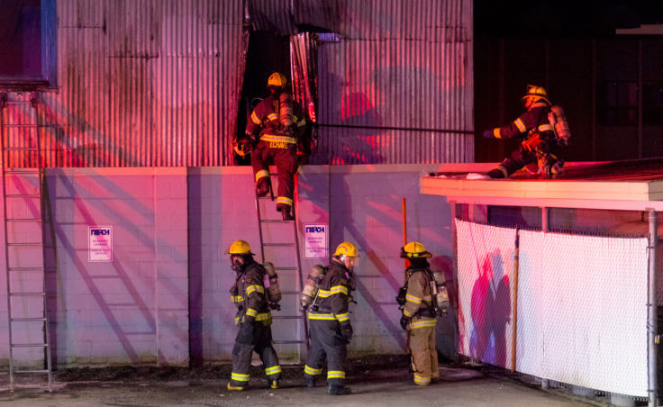 Capital City Fire/Rescue fights a fire in the 200 block of North Franklin Street on the evening of Monday, April 16, 2018. (Photo by Mikko Wilson/KTOO)