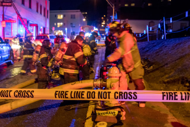 Capital City Fire/Rescue fights a fire in the 200 block of North Franklin Street on the evening of Monday, April 16, 2018. (Photo by Mikko Wilson/KTOO)