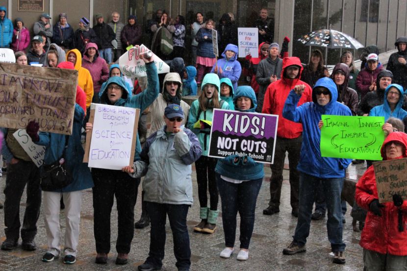 Rally participants cheer in the rain at the second annual March for Science in Juneau on April 14, 2018. (Photo by Adelyn Baxter/KTOO)
