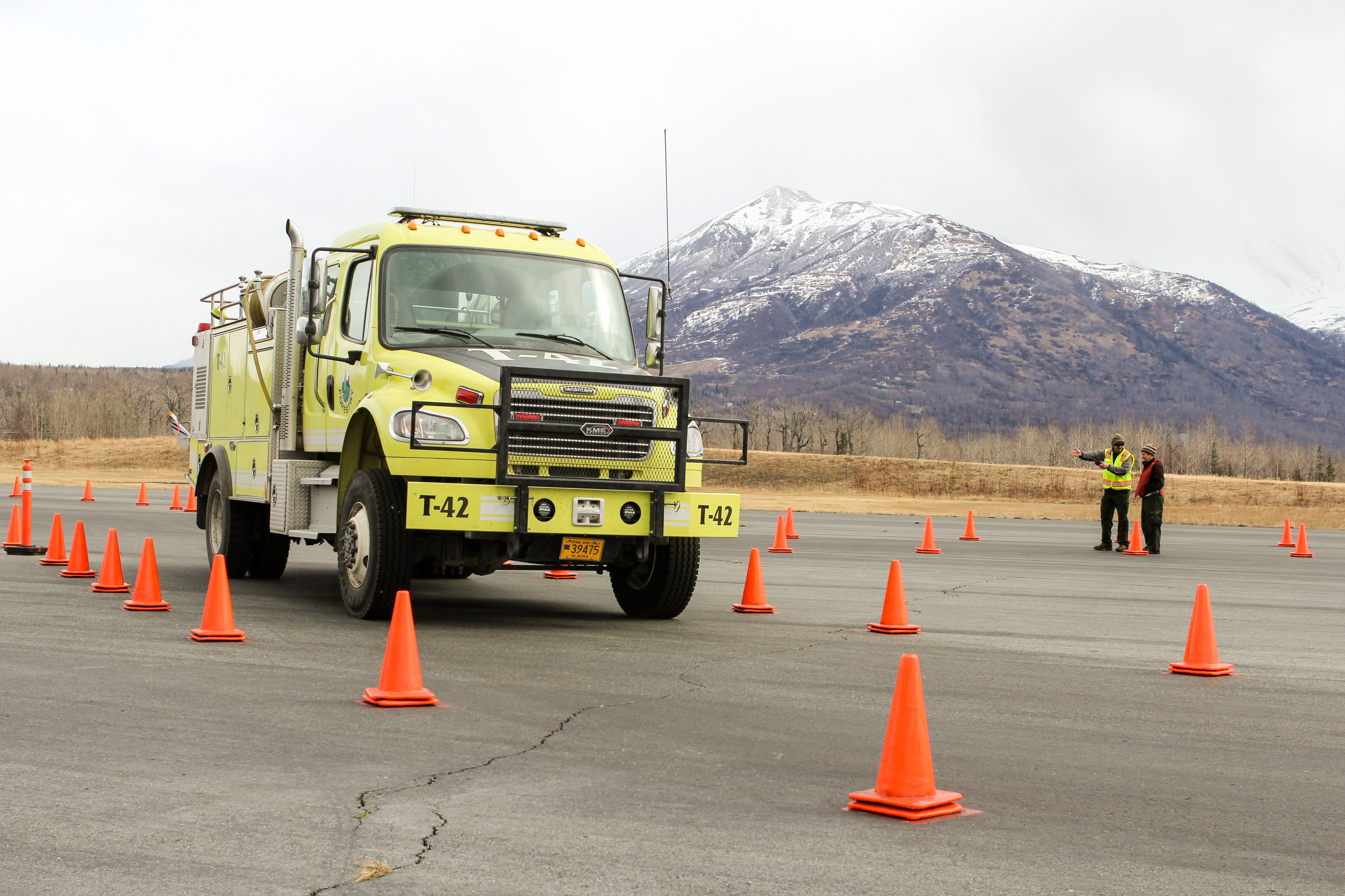 A firefighter receives driving instructions during training at the Alaska Division of Forestry in Palmer on Thursday, April 28, 2018. (Photo by Casey Grove/Alaska Public Media)