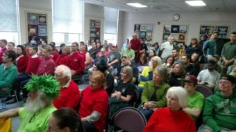 Most of the standing-room-only crowd that turned out for Monday’s City Council meeting identified themselves by wearing red shirts, for those supported stricter marijuana regulation, and green shirts, for those favoring looser regs. (Photo by Tim Ellis/KUAC)