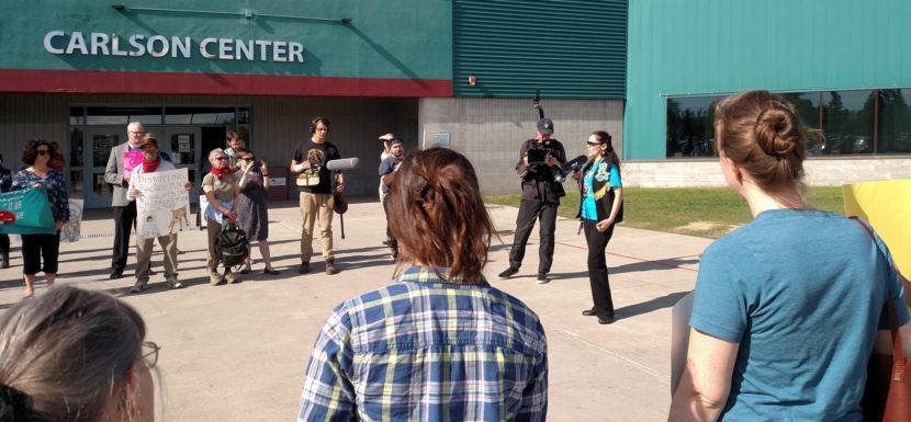 Fort Yukon Gwich’in Bernadette Demientieff, of the Gwich'in Steering Committee addresses protesters during their rally at the Carlson Center in Fairbanks on May 29, 2018. After the protest, they went inside and joined the meeting to offer testimony against opening ANWR's coastal plain to oil and gas development.