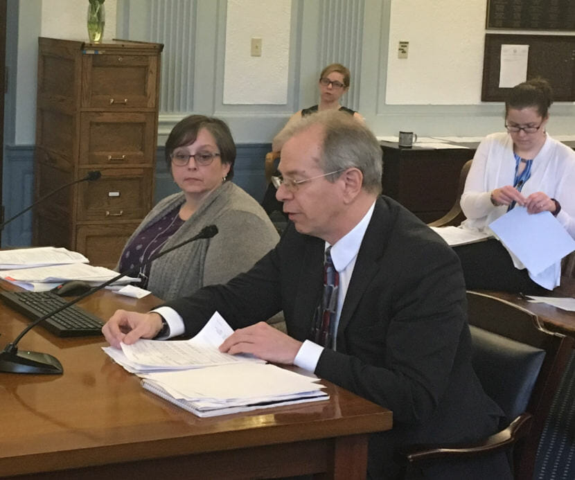 Division of Public Assistance Director Monica Windom and Department of Health and Social Services Deputy Commissioner Jon Sherwood present information about Medicaid to the Senate Finance Committee on Tuesday. The committee discussed Senate Bill 193, which would require Medicaid recipients to work, study, volunteer, engage in subsistence activities or provide caregiving. (Photo by Andrew Kitchenman/KTOO)