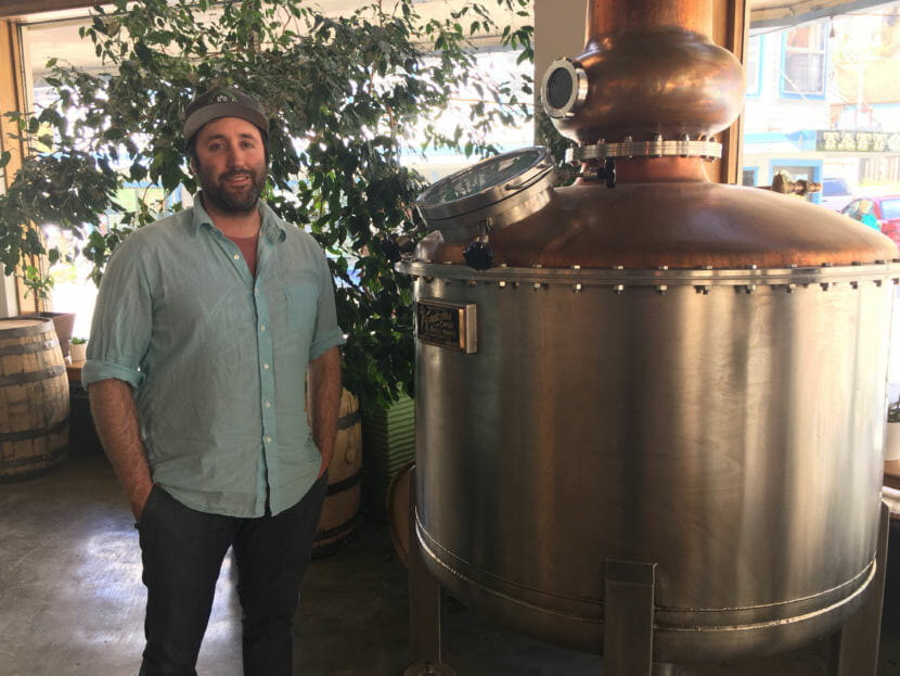 Amalga Distillery co-owner Brandon Howard opposes a proposal to reduce the amount breweries and distilleries can sell as samples. His Juneau business has benefited from the sales. (Photo by Andrew Kitchenman/KTOO)