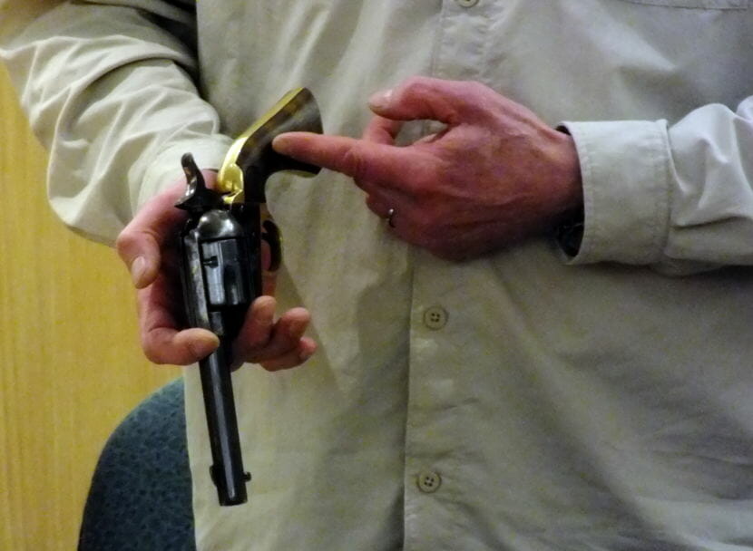 Firearms dealer and instructor Chad Kendrick testifies in the Mark DeSimone homicide trial and shows jurors the various parts of a revolver and how it operates.