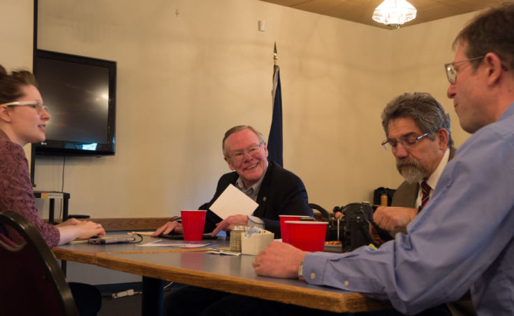 Sen. Dennis Egan, center, chats with his legislative staffers Sorcha Hazelton, left, and Peter Naoroz, right, and former staffer Jesse Kiehl, far right, at the Juneau Moose Lodge on May 31, 2018. Egan was the featured speaker at the Juneau Chamber of Commerce luncheon.