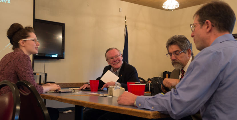 Sen. Dennis Egan, center, chats with his legislative staffers Sorcha Hazelton, left, and Peter Naoroz, right, and former staffer Jesse Kiehl, far right, at the Juneau Moose Lodge on May 31, 2018. Egan was the featured speaker at the Juneau Chamber of Commerce luncheon.