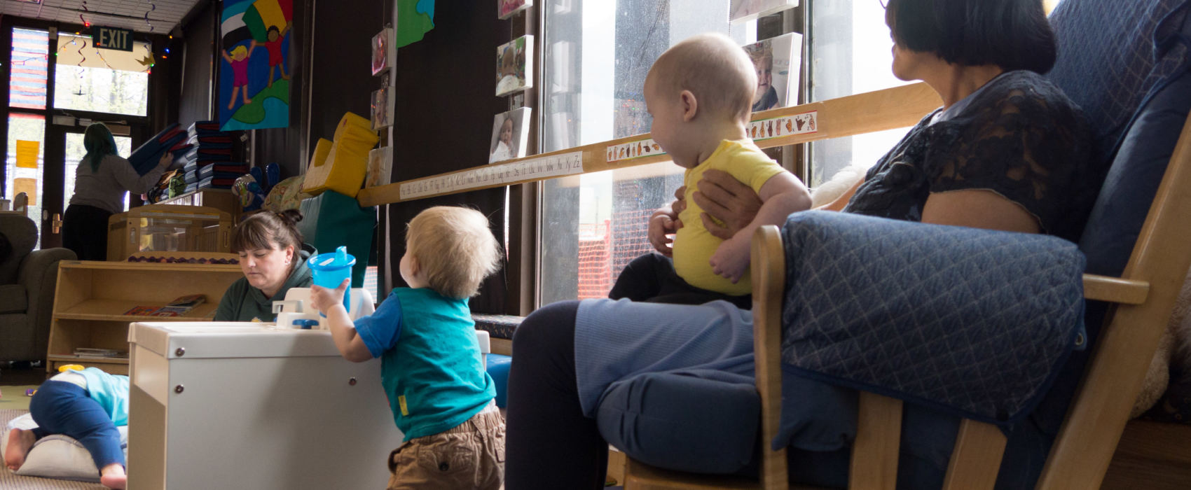 Child care workers interact with infants at Gold Creek Child Development Center in Juneau on May 11, 2018. State rules require certain square footage and staffing levels, which limit this center's infant care capacity to 10. New state rules being proposed may force that capacity down to 8.