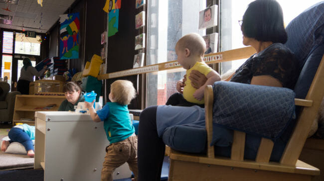 Childcare workers interact with infants at Gold Creek Child Development Center in Juneau on May 11, 2018. State rules require certain square footage and staffing levels, which limit this center's infant care capacity to 10. New state rules being proposed may force that capacity down to 8.