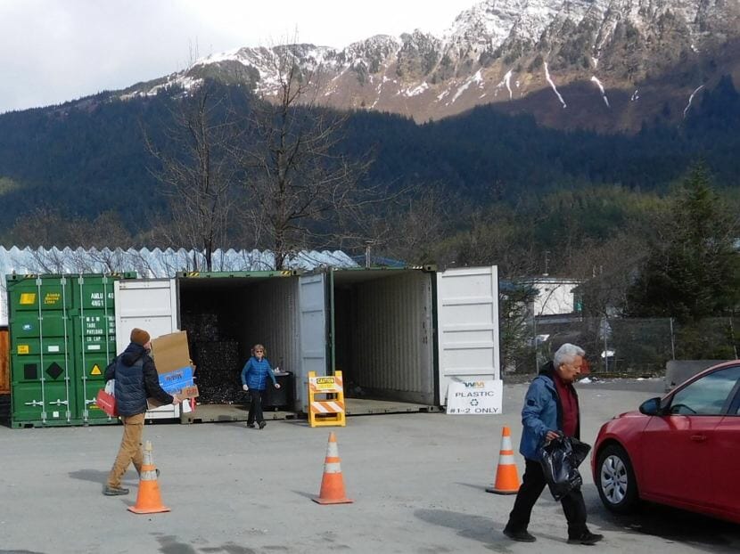 Juneau residents drop off cardboard, paper, aluminum and plastics at the Juneau Recycling Center on March 28, 2018. (Photo by Ed Schoenfeld/CoastAlaska News)