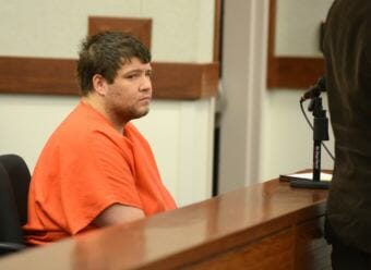 Seth Loggins confers with public defender Jeff Bradley at his bail hearing Tuesday afternoon at the Palmer courthouse. (Photo by Bob Hallinen/Anchorage Daily News)