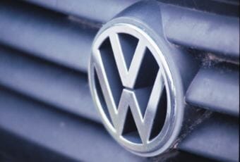 The Volkswagen emblem on the grill of a Jetta.