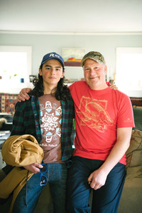 Jeremy Schimmel, with his son Sam, says of Sam's childhood in Alaska: "He never was inside. He hunted and fished." (Photo by Kiliii Yuyan for NPR)