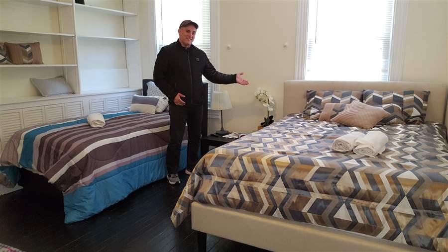 Al Hallivis in a Baltimore property of his, one of half a dozen short-term rental houses he owns. (Photo by Pew Charitable Trusts)