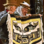 Nathan Jackson, left, and Della Cheney hold up a blanket made by Dorica Jackson during a weavers' presentation at the Shuka Hit clan house at the Walter Soboleff Building in downtown Juneau on June 6, 2018.