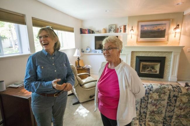 Former Alaska state legislator Alyce Hanley, right, talks with her friend Susan Fison, a former Anchorage planning director, in the apartment Hanley built into the bottom floor of her home in Sand Lake on Thursday, June 7, 2018. Hanley, who is 84, wanted to live with her children but have her own living space. (Loren Holmes / ADN)