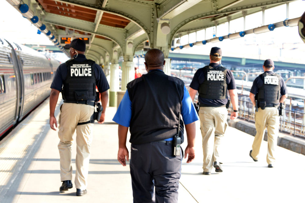 Department of Homeland Security and Transportation Security Administration agents work in 2015 at an Amtrak station. (Photo by Barry Bahler/Department of Homeland Security)