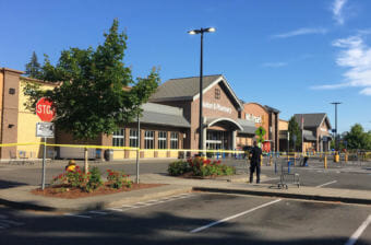 Police block the scene outside a Walmart in Tumwater where a gunman shot a driver, then was himself shot to death on Sunday afternoon. (Photo by Austin Jenkins/Northwest News Network)