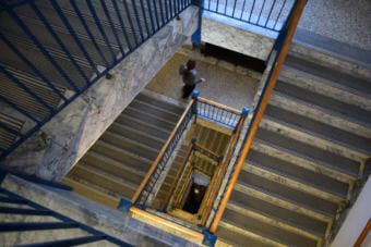 Someone takes the stairs down the Alaska State Capitol building in Juneau on Feb. 9 , 2015. The stairwell divides the building into two wings.