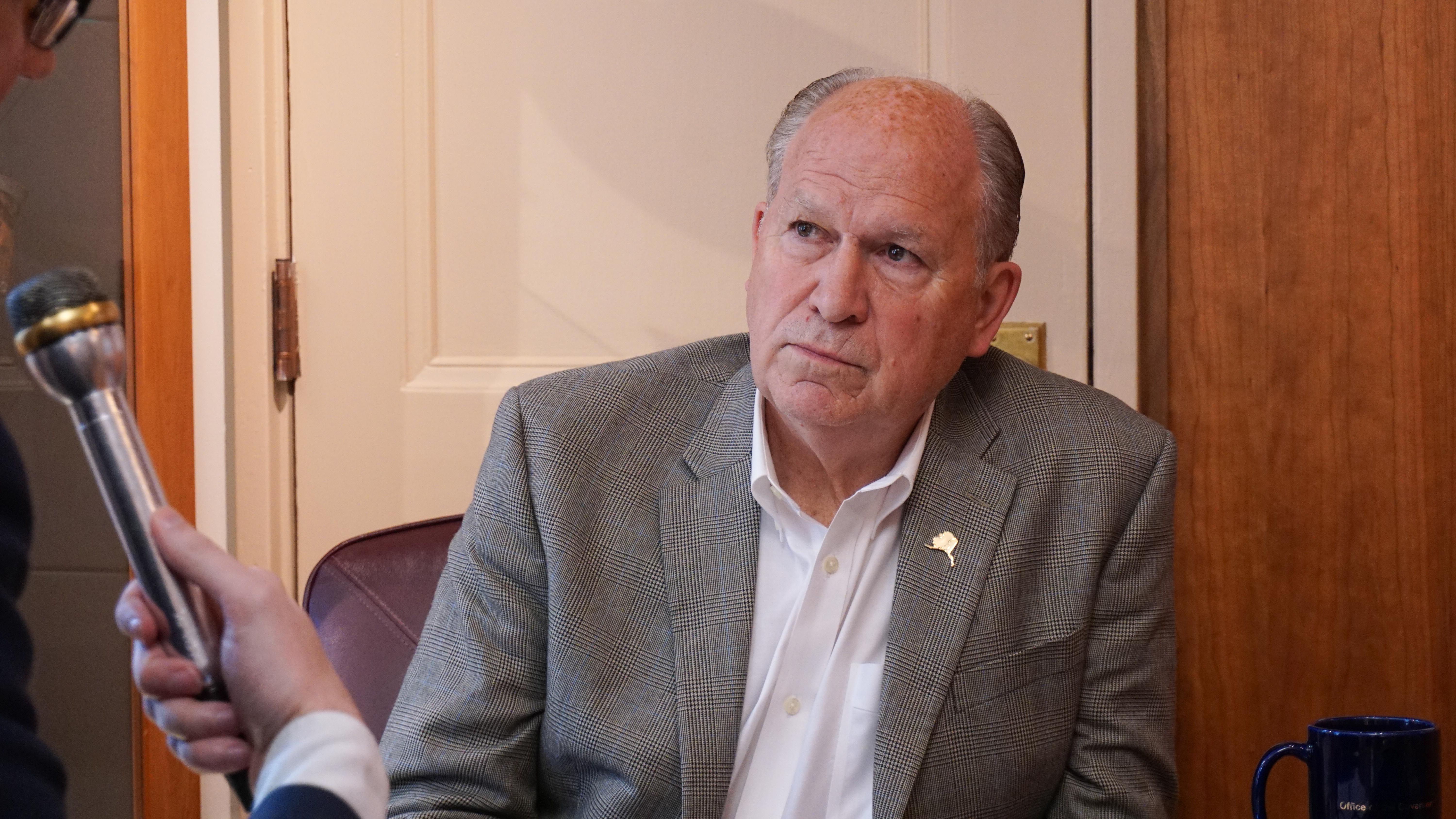 Alaska Gov. Bill Walker listens to a question from KTOO and Alaska Public Media reporter Andrew Kitchenman in his Capitol office in Juneau on June 19, 2018.