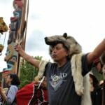 A member of the Yanyeidí clan dances to celebrate the raising of the Gooch (wolf) totem pole at Savikko Park. June 6, 2018. (Photo by Adelyn Baxter/KTOO)