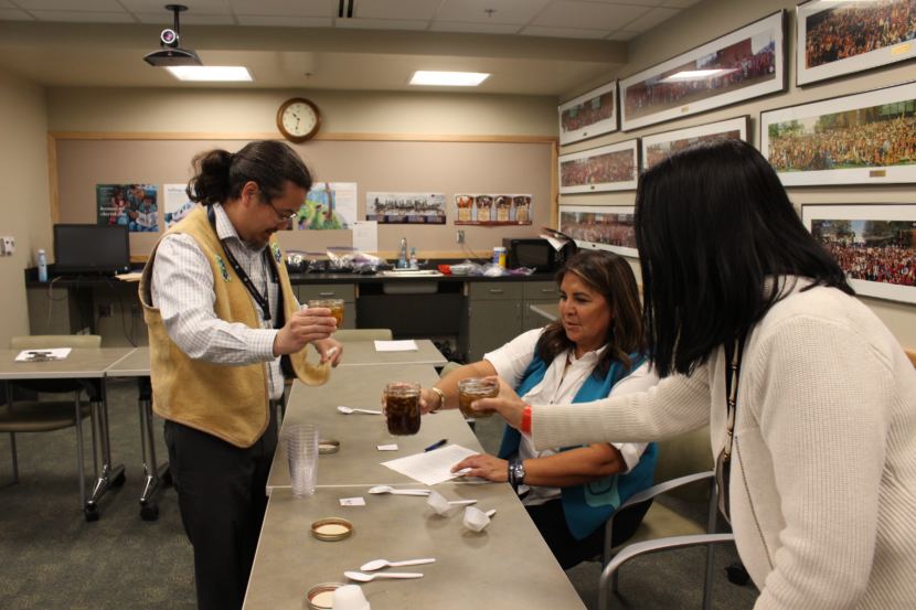 The judges get done scoring the seal oil with crackling. (Photo by Elizabeth Jenkins/Alaska's Energy Desk)