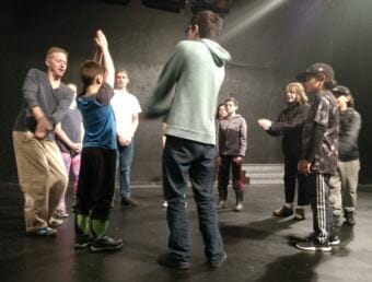 Director K. Brian Neel leads a theater exercise with student actors at Perseverance Theatre on June 26, 2018. The Douglas theater produces three student productions each season. (Photo by Jacob Resneck/KTOO)