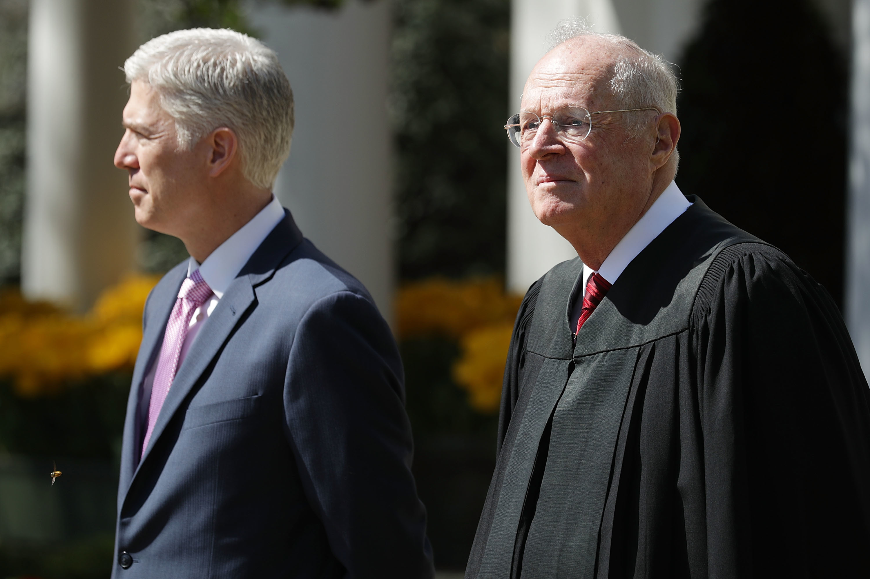 Supreme Court Associate Justice Anthony Kennedy, right, prepares to administer the judicial oath to Judge Neil Gorsuch during a ceremony in the Rose Garden at the White House in 2017. (Photo by Chip Somodevilla/Getty Images)