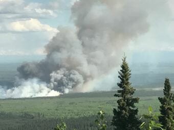 The smoke plume of the Livingston Fire approximately 15 miles southwest of Fairbanks in the Rosie Creek area as seen from Mile 339 of the Parks Highway early Sunday evening, July 8, 2018.