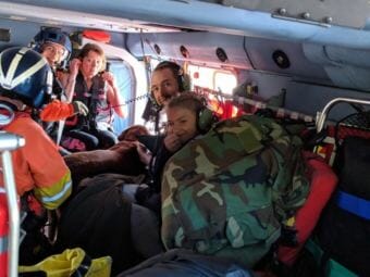 A happy 13-year old kayaker and her clearly relieved aunt and uncle catch a ride back to North Beach cabin in an Air Station Sitka H-60 rescue helicopter. Authorities believe warm temperatures and calm conditions were huge factors in the successful outcome. (Photo courtesy U.S. Coast Guard)