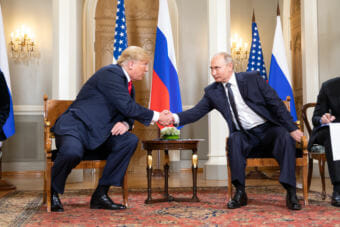 U.S. President Donald Trump and Russian President Vladimir Putin shake hands in Helsinki on July 16, 2018.