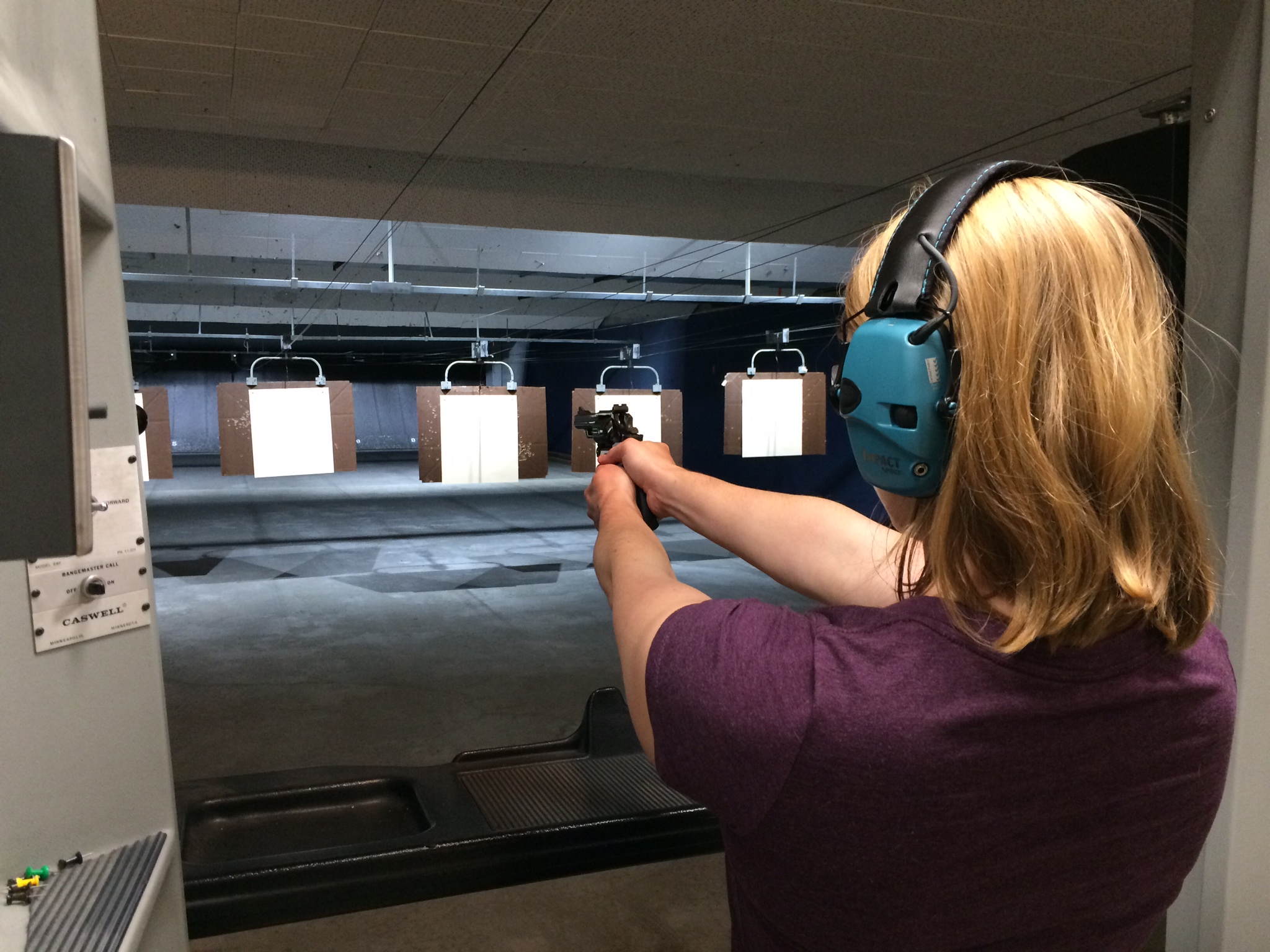 Participant Andrea Turner practices dry firing her pistol at the women’s pistol clinic, a four-week course offered by the Sitka Sportsmen’s Association. (Photo by Katherine Rose/KCAW)