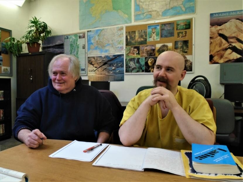 Jim Hale and Lowell Ford sit in the library at Lemon Creek Correctional Center after Latin class on June 11, 2018. (Photo courtesy of Paul McCarthy/Department of Corrections)