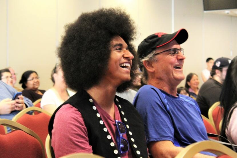 AJ Hoyle laughs during the premiere of "Ix̱six̱án, Ax̱ Ḵwáan (I Love You, My People)." (Photo by Adelyn Baxter/KTOO)