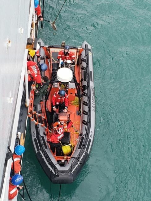 The Coast Guard helps bring a rescued kayaker aboard the Douglas Munro in Glacier Bay on July 15, 2018.