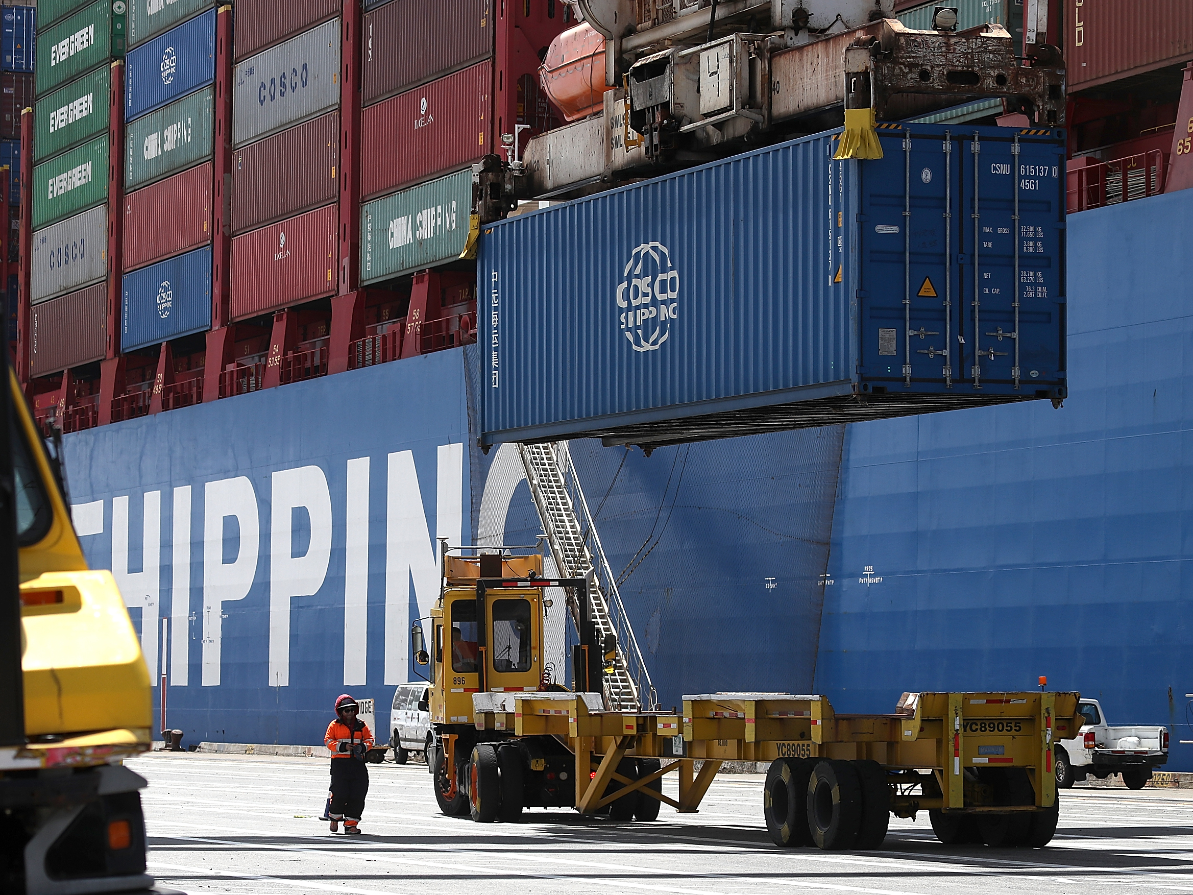 A shipping container is offloaded from the Hong Kong-based ship in Oakland, Calif., last month. (Photo by Justin Sullivan/Getty Images)